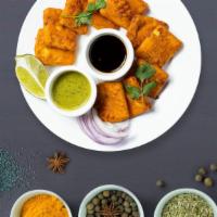 Pakora Pleasure · Assorted vegetables dipped in a light batter and fried until golden brown.
