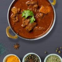 Righteous Lamb Vindaloo · Juice lamb cooked in a spicy pungent curry with potatoes.