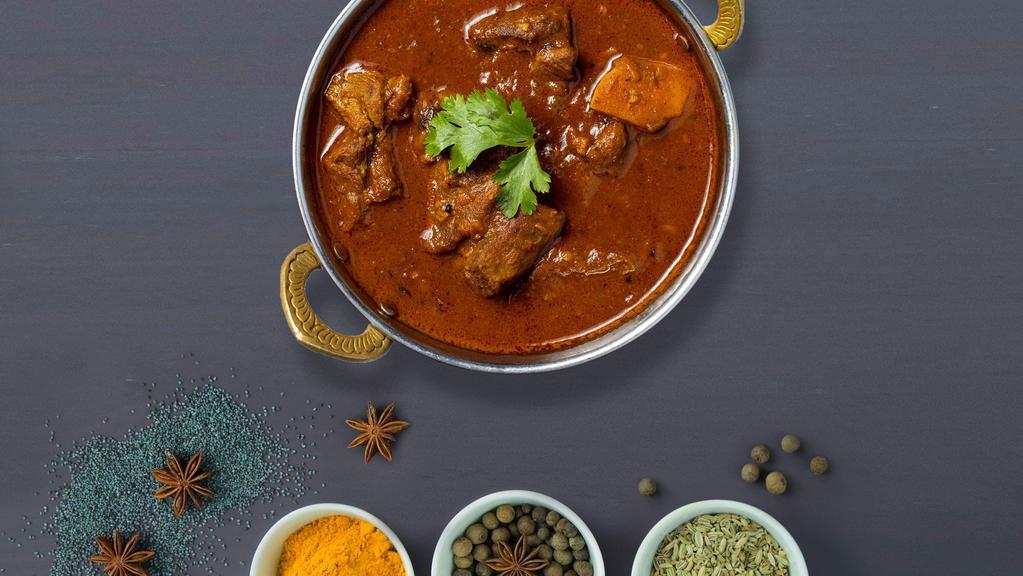 Righteous Lamb Vindaloo · Juice lamb cooked in a spicy pungent curry with potatoes.