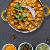 Chosen Chana Masala · Chickpeas cooked in a tomato and onion gravy with Indian spices.