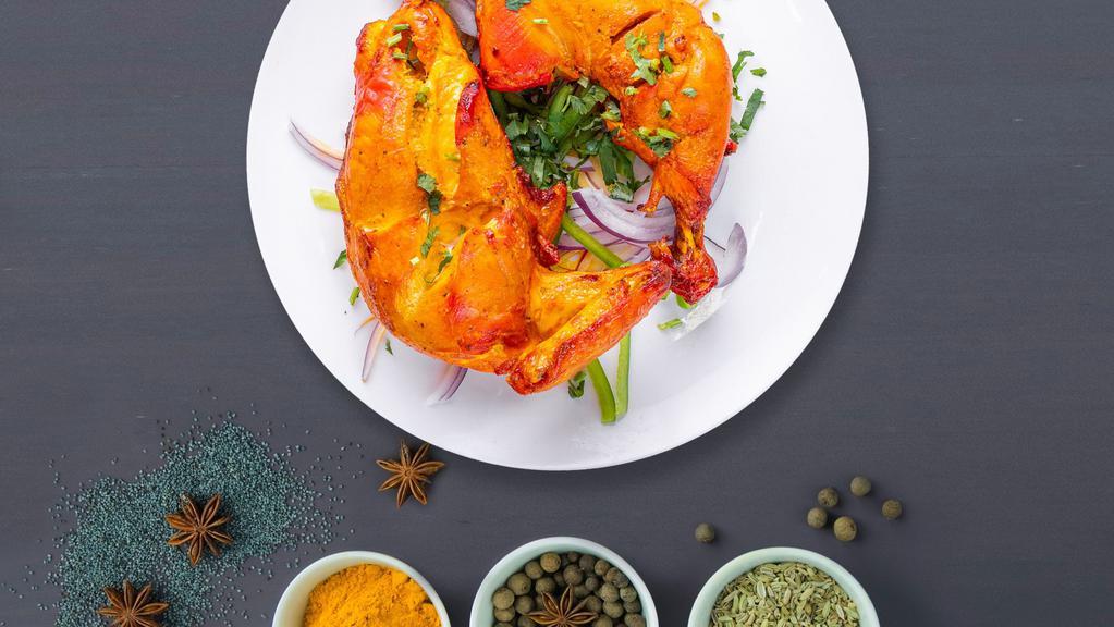 The Classic Chicken Tandoori · Juicy chicken dipped in a yogurt & ground spice marinate and baked in a tandoor clay oven