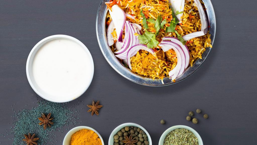 Veggie Lover Biryani · Spiced seasoned vegetables cooked with Indian spices and basmati rice.