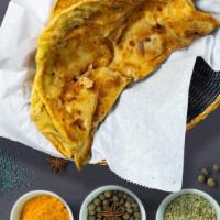 Aloo Paratha · Indian bread stuffed with spiced potatoes and cooked on a tawa pan.