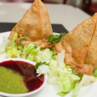 Samosa · Two crispy pastries filled with your choice of freshly mixed vegetables or delicately spiced...