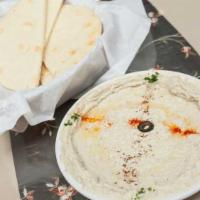 Hummus Bi-Tahini · Gluten-free, vegan. The original middle Eastern dip of garbanzo beans, tahini sauce and a sp...