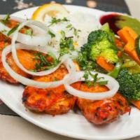 Tandoori Chicken Tikka · Gluten-free. Succulent pieces of boneless chicken rubbed with Indian herbs and spices and ma...