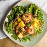 Mango Shrimp Salad · Gluten-free. Mango, shrimp, red onion, white onion, green onion, cilantro, and vermicelli wi...