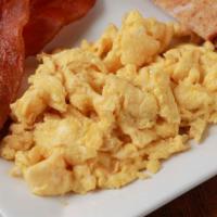 Bacon And Eggs · 3 scrambled eggs served with crispy bacon, tater tots, choice of buttered toast, side of hot...
