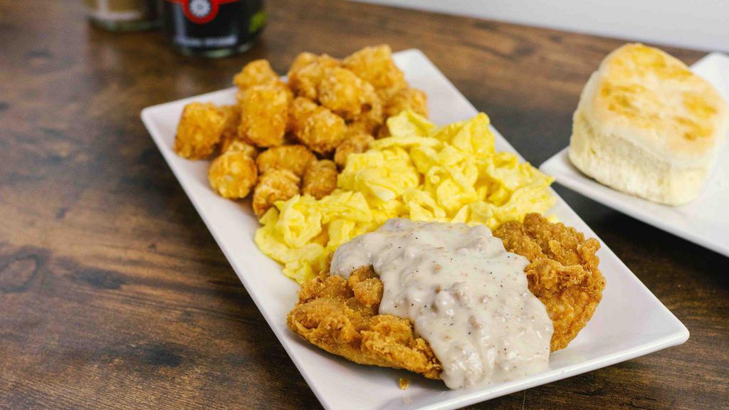 New!: Chicken Fried Chicken & Eggs · Crispy chicken breast topped with house-made country sausage gravy, a side of scrambled eggs, crispy tater tots and a biscuit on the side.