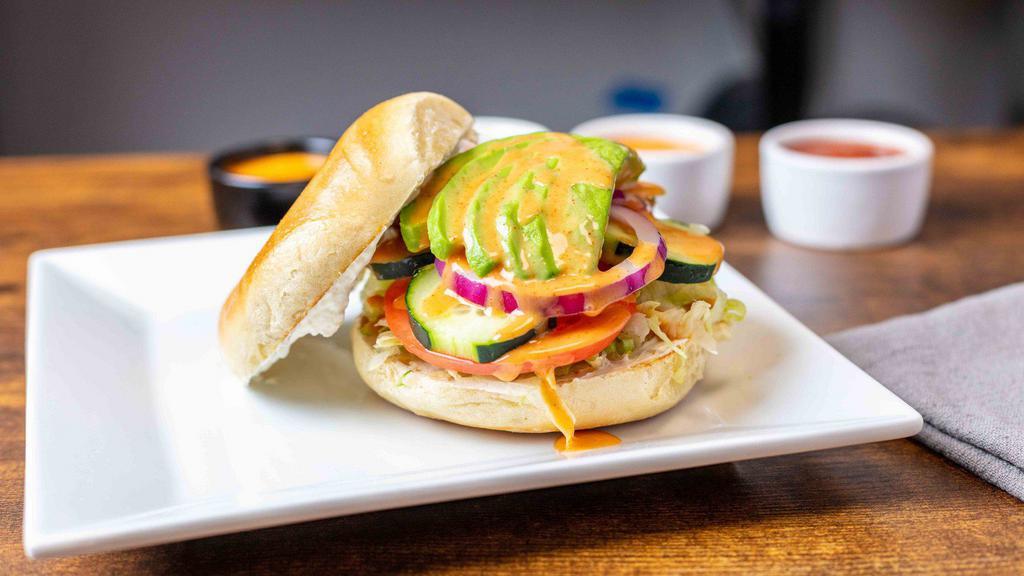 Avocado Veg Out Bagel (Cold Sammy) · Lettuce, tomato, cucumber, red onion, avocado, cream cheese finished with a drizzle of honey blaze on toasted plain bagel.