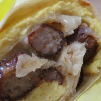Breakfast Burrito · Scrambled eggs, hashbrown, cheese, and your choice of meat wrapped in a flour tortilla.