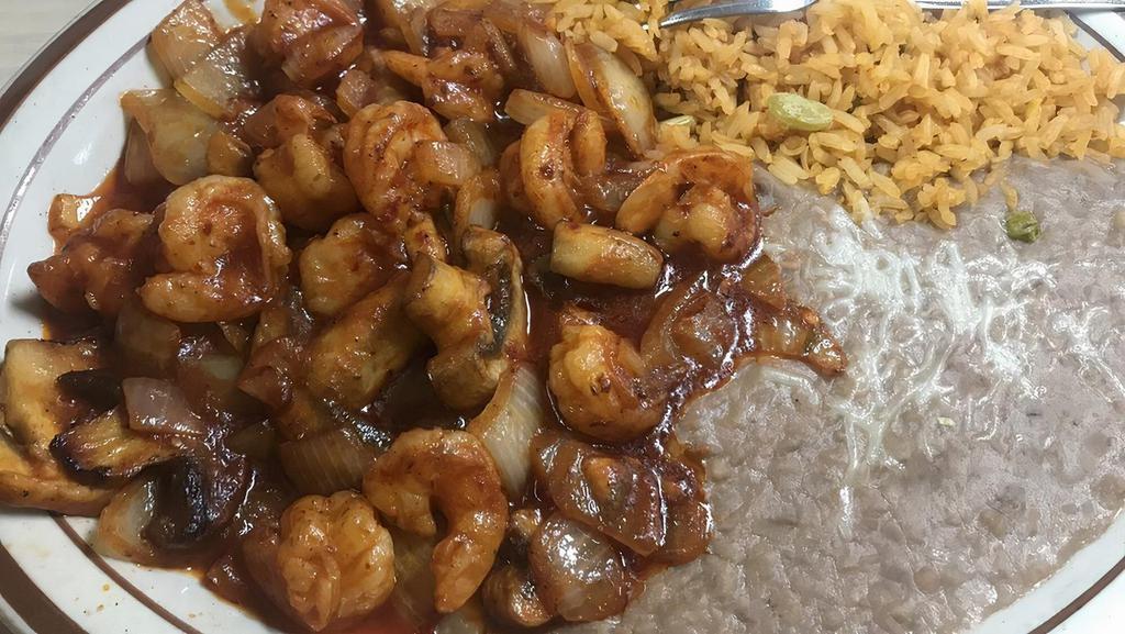 Camarones A La Diabla · Spicy. Double spicy shrimp sautéed in a Mexican red sauce. Served with rice, beans, your choice of tortillas, and a side salad.