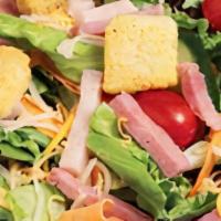 Chef Salad · Field greens, tomatoes, onions, cucumbers, mushrooms, ham, two-blend cheese, and croutons. I...