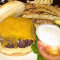 Classic Burger · Our not-so-basic burger is topped with lettuce, tomato, and purple onions. Served on a brioc...