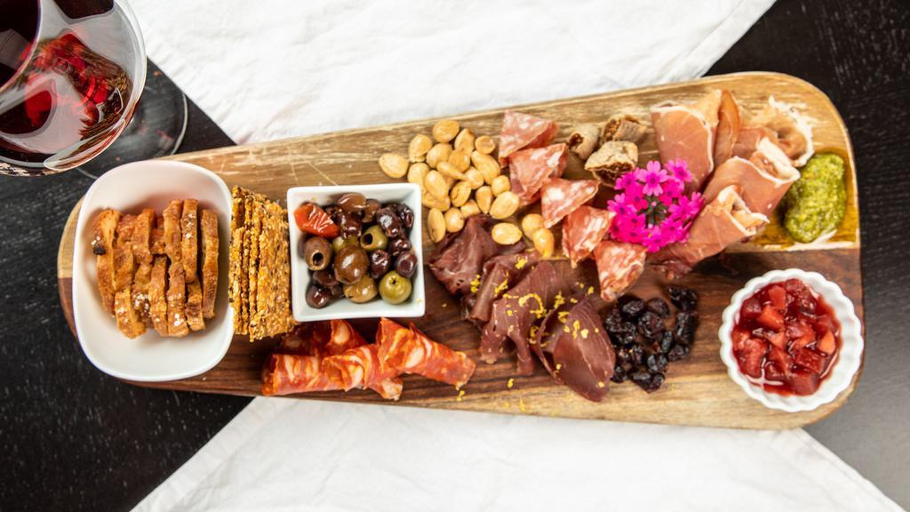 Charcuterie Board · 4 cured meats – prosciutto di parma, bresaola, smoked salami, and calabrian chili salami
Susanne’s Swedish seed crackers, seasonal house made chutney, whole grain mustard and pesto, dried fruits and nuts, olives, and crostini