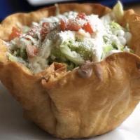 Taco Salad · Crispy flour tortilla, choice of meat, rice, beans, lettuce, onions, cilantro, tomatoes, sou...