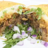 Burrito · Flour tortilla, cheese, rice and beans, birria, onions and cilantro.
