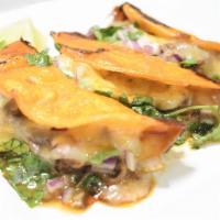 Quesa Tacos · Corn tortilla, cheese, birria, onions and cilantro.