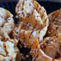 Gooey S'Mores Wontons · Chocolate cheesecake and marsh mellows on the inside, with marsh mellow, chocolate drizzle a...