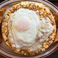 Mess Hall Hobo Hash · Scrambled eggs tossed with hash browns, corned beef hash, ham, sausage, bacon and cheddar to...