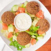 Falafel Appetizer  · Four pieces of Falafels on freshly made salad. With side of Tahini.