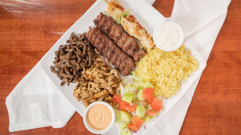 Combo Plate · Mixed plate, Chicken Kabab, Shawarma, rice and salad.