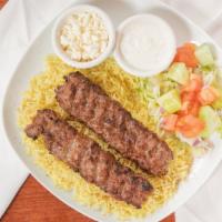 Kabab Plate  · Lamb and Beef kabab rice or salad, side salad and tzatziki.