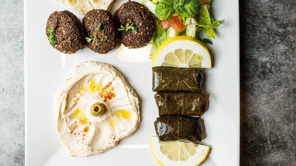Veggie Plate  · Two pieces of falafel & two pieces of grape leaves, baba ghanoush, hummus.