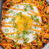 Kimchi Fried Rice · Your choice of protein, brown rice, corn, peas, carrots, fried egg, scallion garnish.