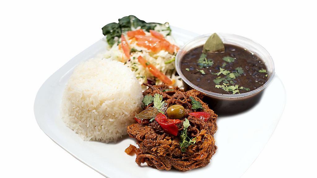 Ropa Vieja Plate · Shredded beef. Served with rice, black beans, salad, onion, cilantro, olives and bell pepper.