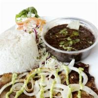 Bistec Plate · Steak. Served with rice, black beans, salad, onion, cilantro and green sauce.