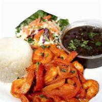 Enchilado De Camaron Plate · Shrimp in a spicy sauce. Served with rice, black beans, salad, onion, cilantro and bell pepp...