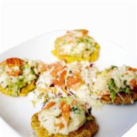 Veggie Tostones · Deep fried green plantains topped with mixed vegetables, mozzarella cheese, cilantro and sal...