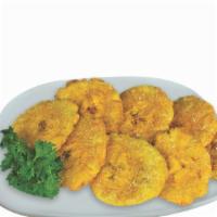 Tostones · Deep fried green plantains.