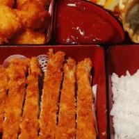 Chicken Katsu · Breaded and fried chicken. Served with steam rice and salad.
