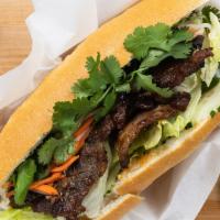 Bánh Mì Thịt Nướng - Vietnamese Grilled Sandwich · Your choice of grilled beef, pork or chicken with pickled carrots, daikon, cucumber, and cil...