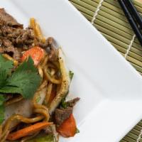 Stir Fry Lo Mein · Chinese egg noodles topped with sauted snow peas, bell peppers, mushrooms, and spinach drizz...
