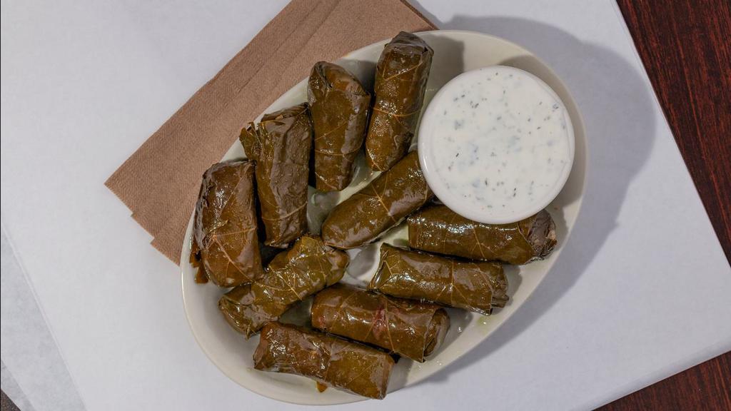 Grape Leaves · Stuffed with rice, onions spices and served with Taziki sauce.