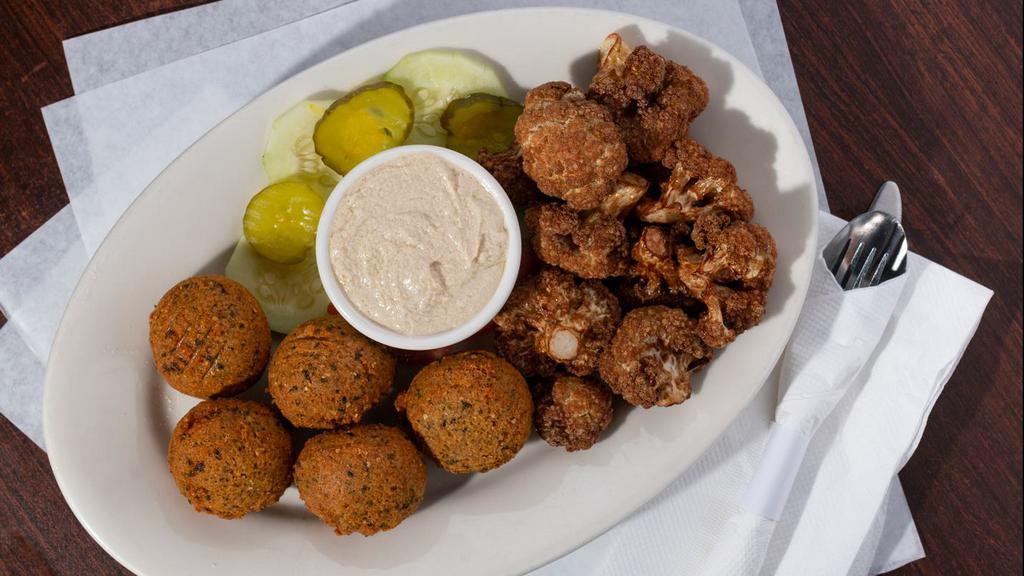 5 Pieces Falafel · Ground fava and garbanzo beans with secret spices hand formed and deep-fried. Served with tahini sauce.