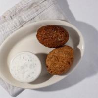 Kibbeh · Beef ground to a fine pate is mixed with cracked wheat. As a meat “dough” it forms two layer...