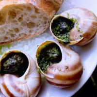 Escargot Aka Snails | Half Dozen  · Half a dozen snails in a garlic herb butter with baguette