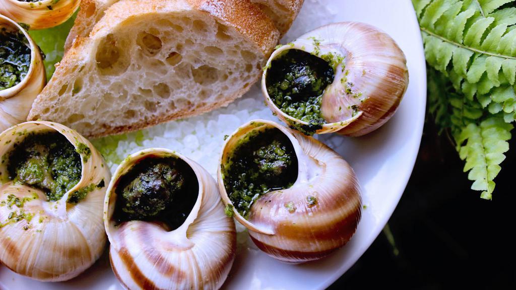 Escargot Aka Snails | Half Dozen  · Half a dozen snails in a garlic herb butter with baguette