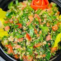 Tabbouleh Salad · A healthy Mediterranean salad made with parsley, tomatoes, onions, mint, lemon, extra virgin...