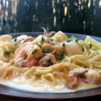 Seafood Pasta · Shrimp, scallops, calamari, and fish sautéed and tossed in a soy-wine garlic sauce or Japane...