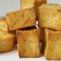 Fried Crispy Tofu. · Golden fried fresh tofu served with plum sauce and roasted ground peanut.