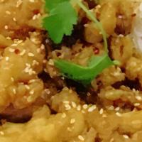 Sesame Chicken. · Crispy fried chicken stir-fried with our delicious sauce topped with sesame seeds, served wi...