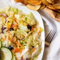 House Salad · Mixed green topped with cucumbers black olives tomatoes and shredded cheddar.