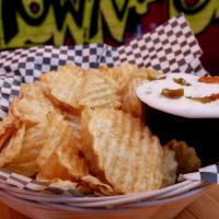Green Chile Dip & Chips · Housemade potato chips served with creamy green chile dip.