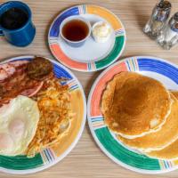 The Lumberjack Breakfast · Three eggs served with a thick slice of ham, two sausages, two strips of bacon, hash browns ...