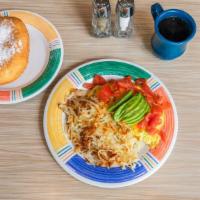 Vegetarian Cheddar Omelette · Onions, green peppers and mushrooms covered in cheddar cheese and served with tomatoes, avoc...